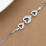 Zircon Studded Heart Interlocked Silver Bracelet
