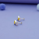 side angle of silver kid stud with south screw